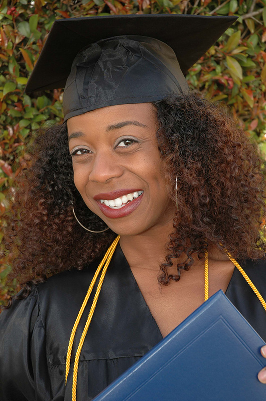 Picture of Black woman in cap and gown at graduation